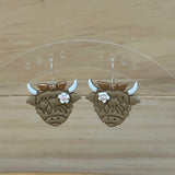 Highland Cow with flower